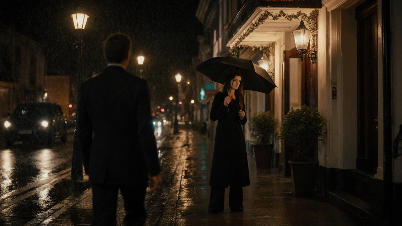 An escort and client meeting outside a hotel at night under a streetlamp in the rain.