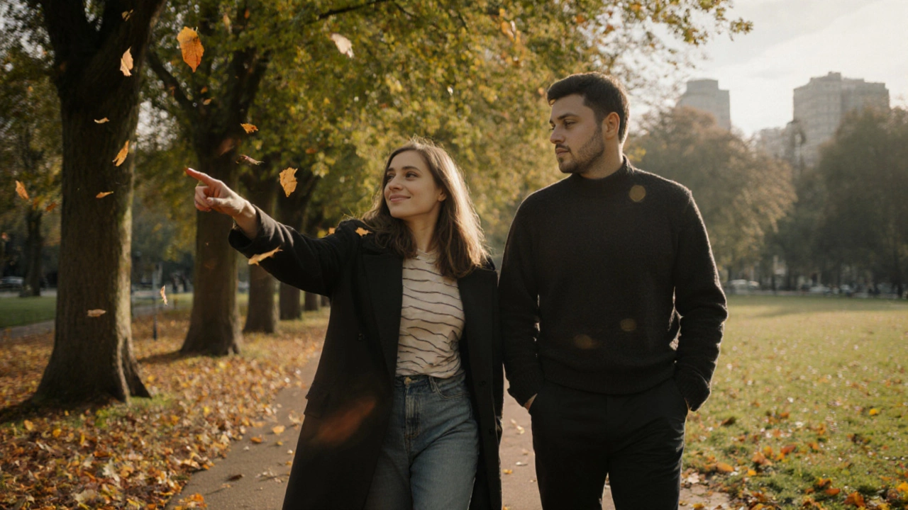 Two people walking peacefully through Hyde Park in autumn, lost in quiet conversation.