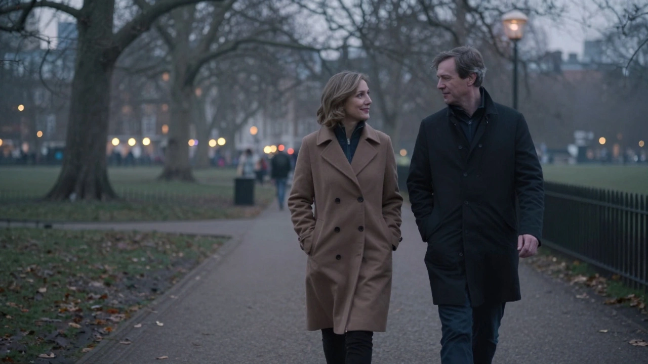 A man and woman walk side by side in a misty London park at dusk, calm and close, sharing a moment of peaceful connection.