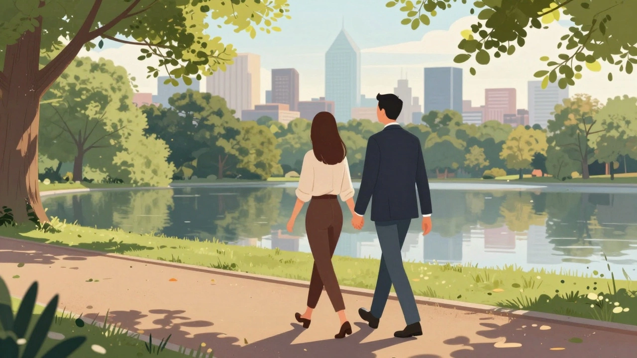 Couple walking in Hyde Park with London skyline reflection