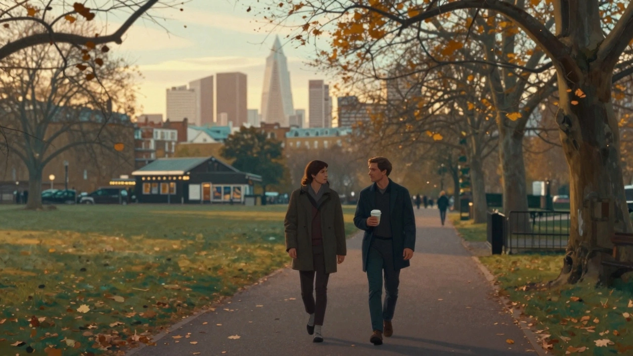 Two figures walking peacefully through Victoria Park at sunset, enjoying quiet conversation amid trees and distant city lights.